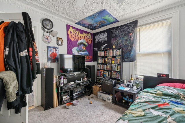 bedroom with carpet floors and ornamental molding