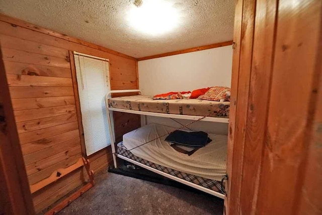 carpeted bedroom with a textured ceiling