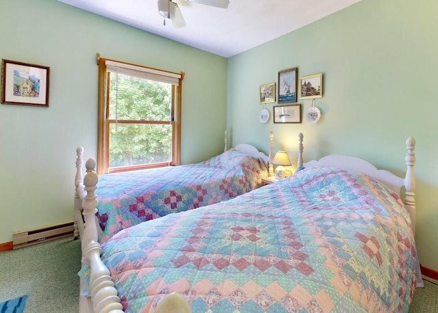 bedroom with a baseboard heating unit, ceiling fan, and carpet