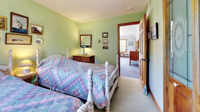 bedroom featuring light carpet