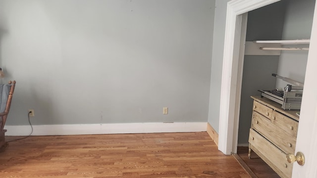 unfurnished bedroom with hardwood / wood-style floors