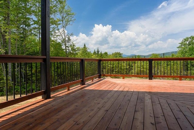 wooden terrace with a mountain view