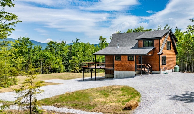 view of front facade featuring central AC and a deck