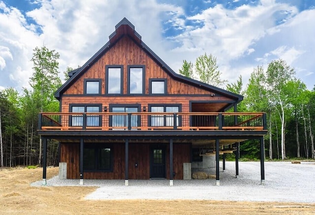 back of house featuring a wooden deck