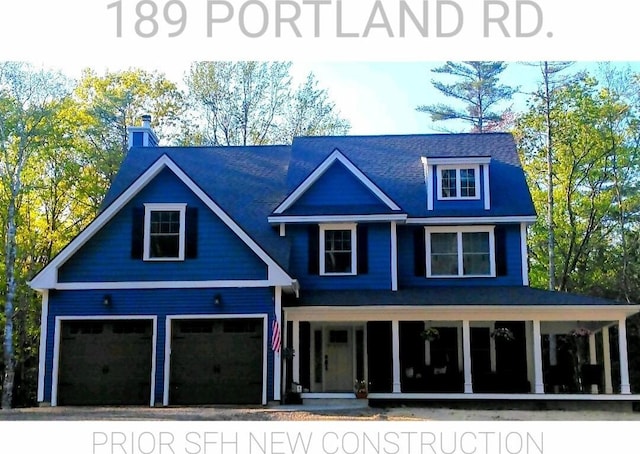 282-284 S St S, Gorham, ME 04038 - view of front of house featuring covered porch, a garage, and a chimney