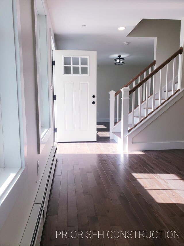 282-284 S St S, Gorham, ME 04038 - foyer with baseboards, baseboard heating, wood finished floors, and stairway