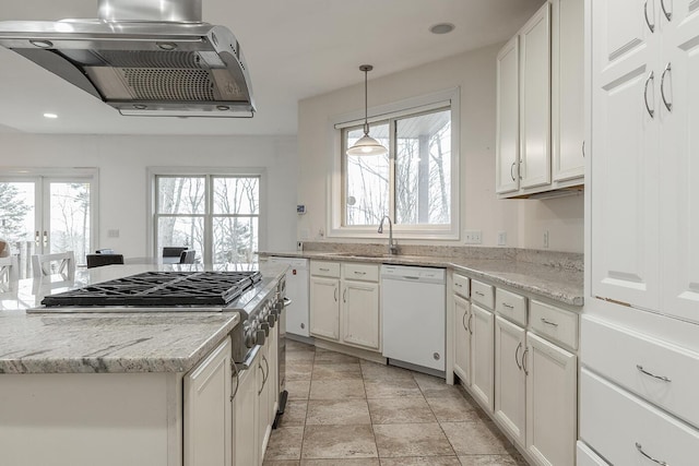 kitchen with range hood, white dishwasher, white cabinetry, and light stone counters