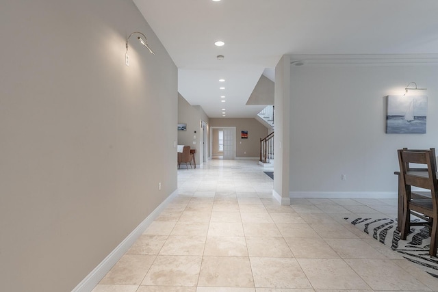 hall with light tile patterned floors