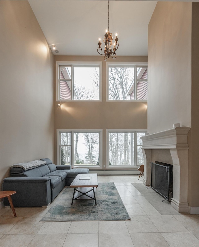 tiled living room featuring a chandelier