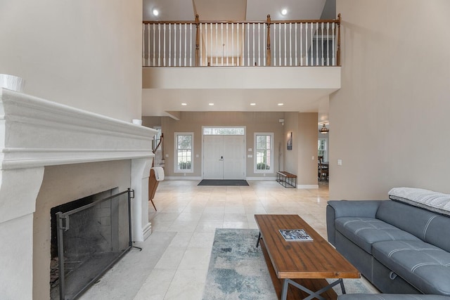 tiled living room with a high ceiling