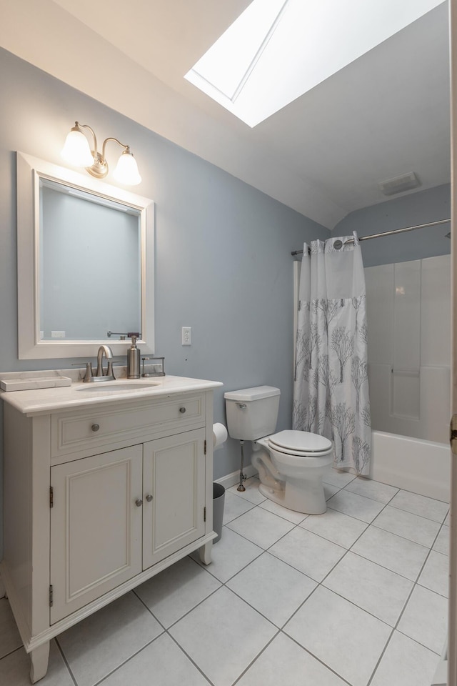 full bathroom featuring toilet, tile patterned flooring, shower / bath combo with shower curtain, vaulted ceiling with skylight, and vanity