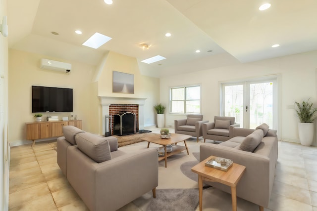 living room featuring french doors, a wall mounted air conditioner, plenty of natural light, and a fireplace