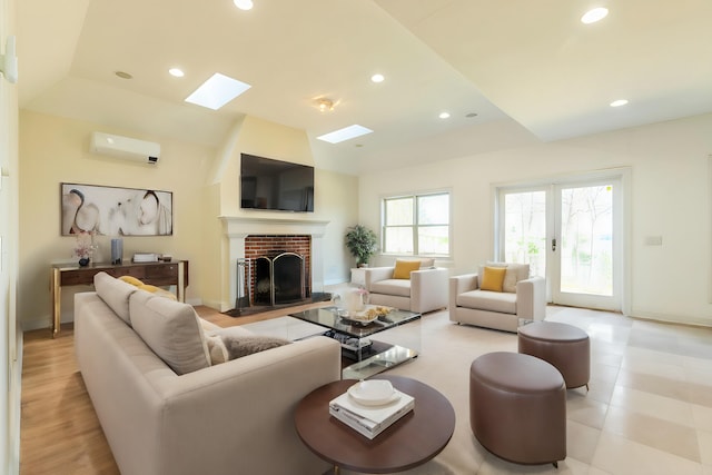 living room featuring a brick fireplace and an AC wall unit