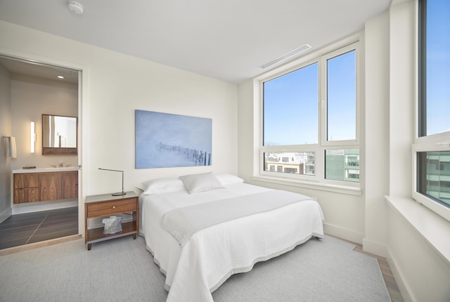 bedroom featuring ensuite bathroom