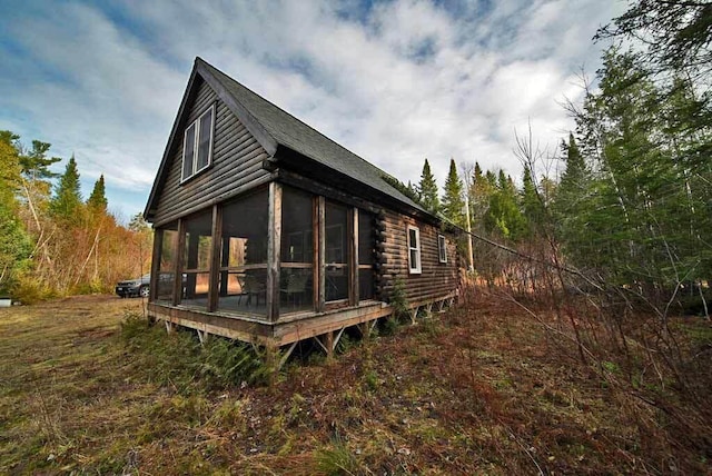 back of house with a sunroom