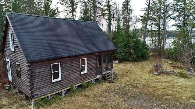 view of property exterior with a water view