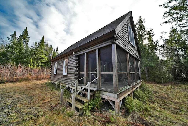 back of house with a sunroom