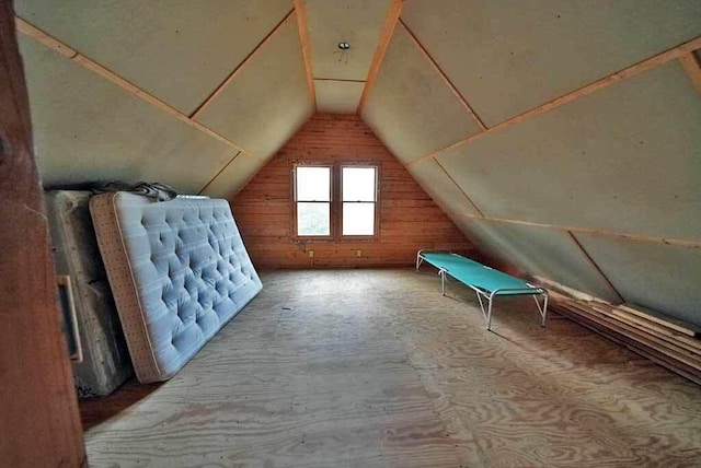 additional living space featuring vaulted ceiling