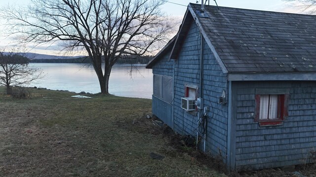 view of outbuilding with a water view