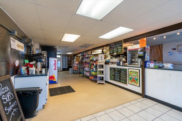 interior space featuring a paneled ceiling