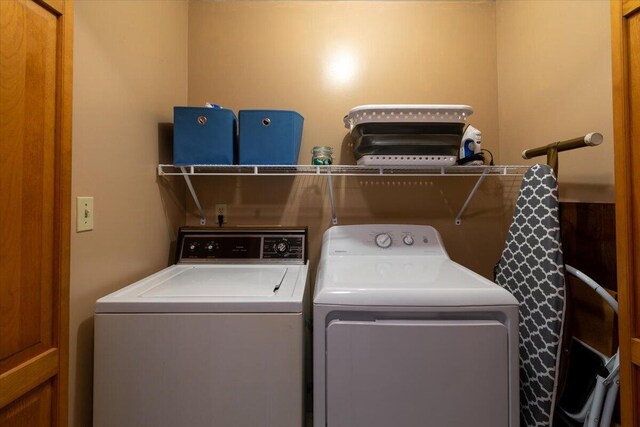 laundry area with separate washer and dryer