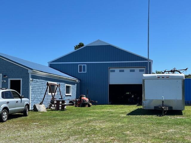 view of side of property with a lawn