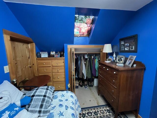 bedroom with a closet and light wood-type flooring