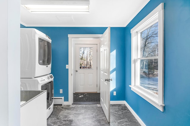 laundry room featuring stacked washer and dryer