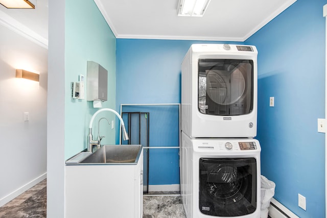 clothes washing area featuring stacked washer / dryer, crown molding, and sink