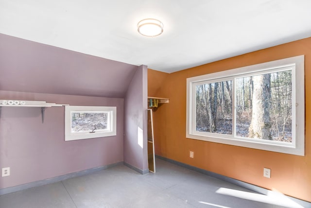 unfurnished bedroom featuring vaulted ceiling