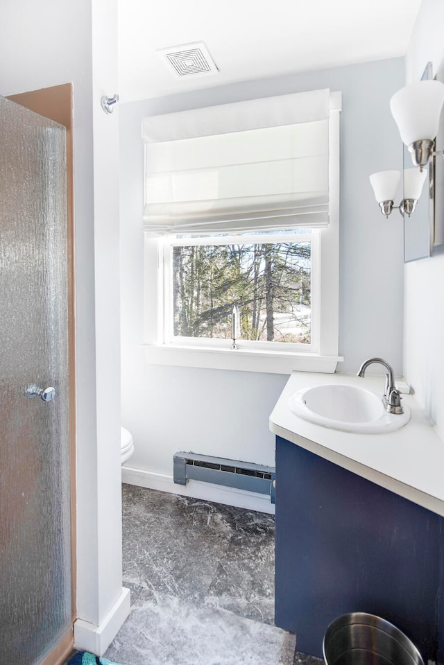 bathroom featuring a baseboard radiator, toilet, vanity, and walk in shower