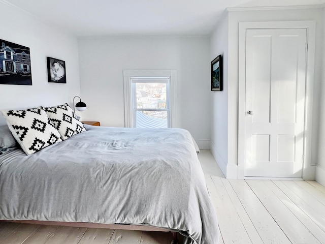 bedroom with light hardwood / wood-style flooring