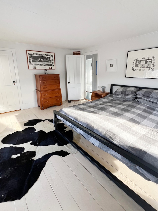 bedroom with light hardwood / wood-style floors