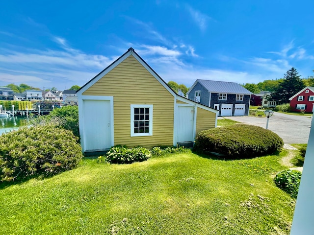 exterior space featuring a water view and a yard