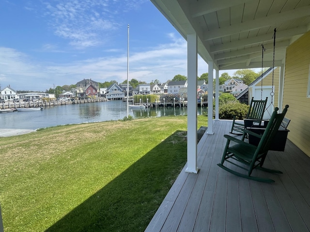27 Clamshell Aly, Vinalhaven, ME 04863 - wooden terrace with a water view, a lawn, and a residential view
