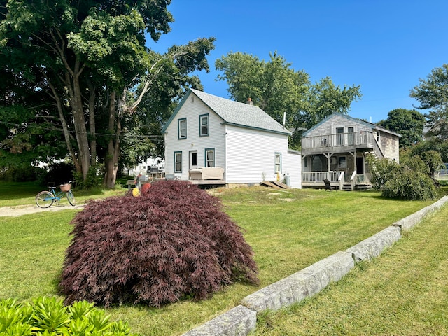 exterior space featuring a deck and a yard