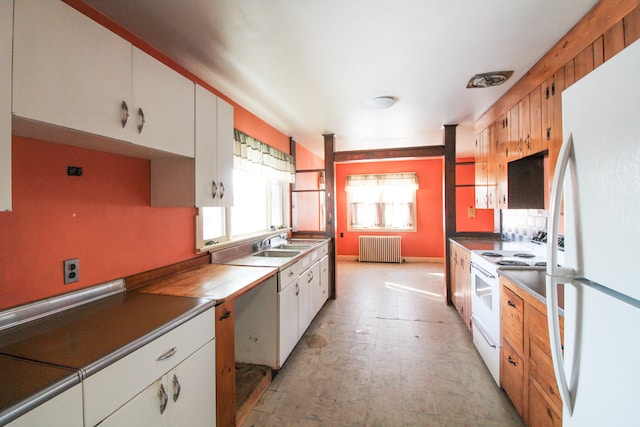 kitchen featuring white cabinetry, white appliances, sink, radiator heating unit, and light tile floors