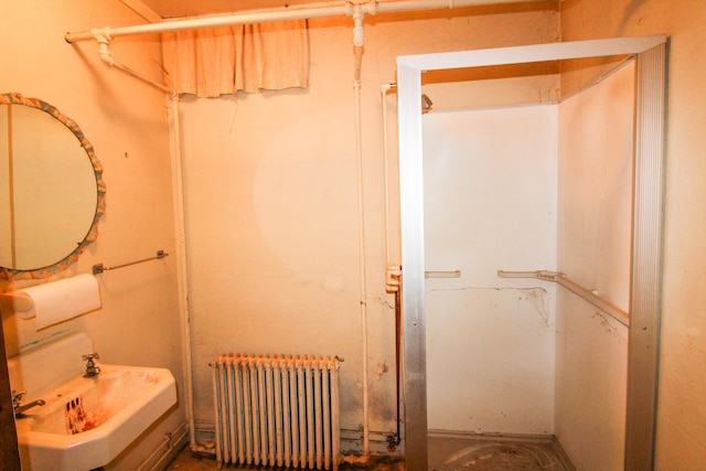 bathroom featuring sink and radiator