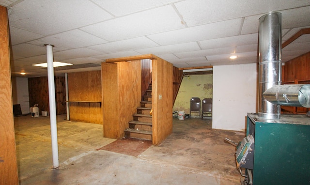 basement with a paneled ceiling