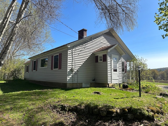 view of property exterior featuring a lawn