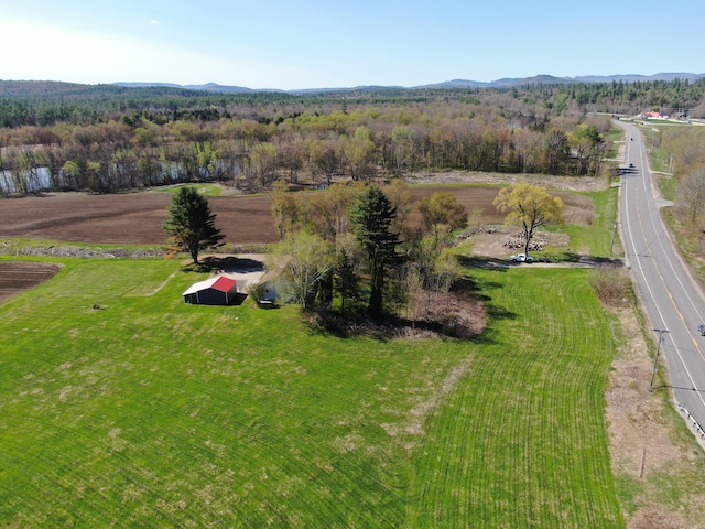 birds eye view of property with a rural view