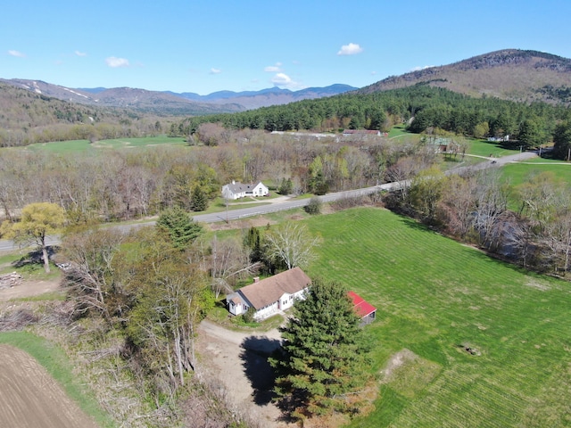 drone / aerial view with a mountain view and a rural view