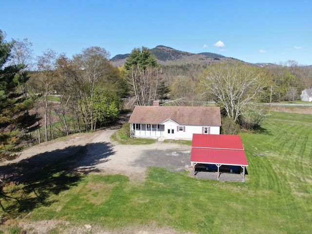 birds eye view of property with a mountain view