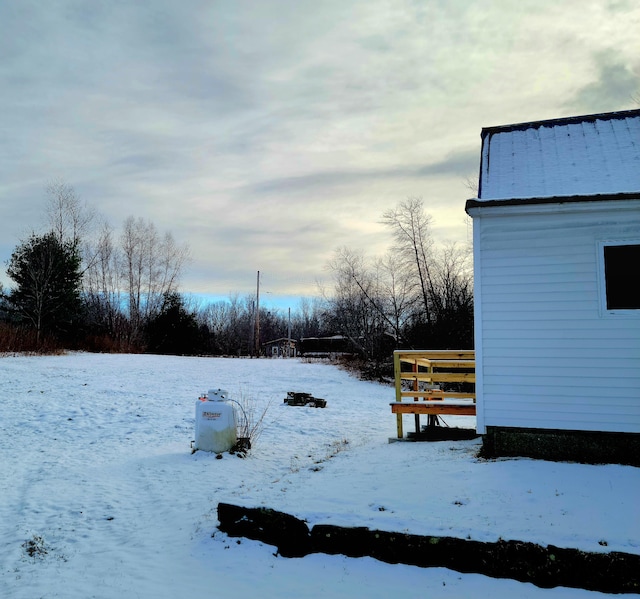 view of yard covered in snow