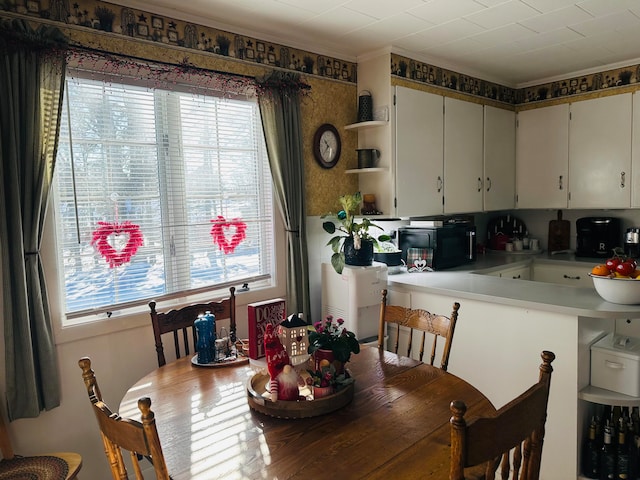 dining room featuring crown molding