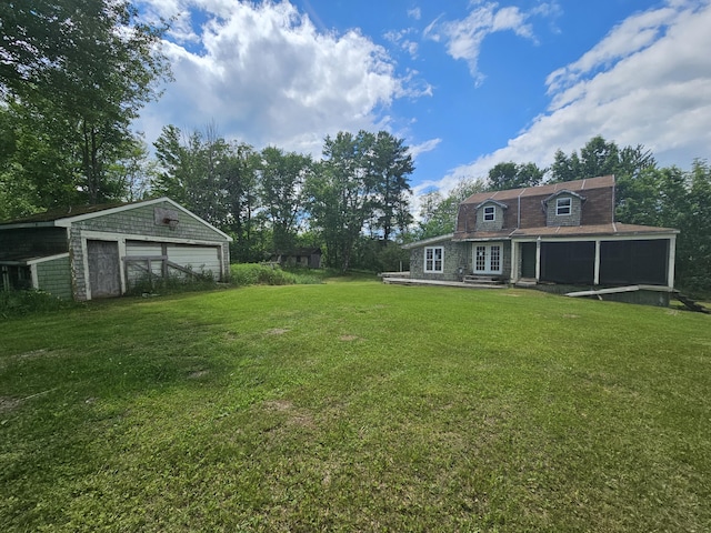 view of yard with an outbuilding and a garage