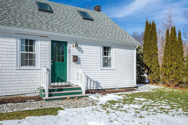 view of snow covered property entrance