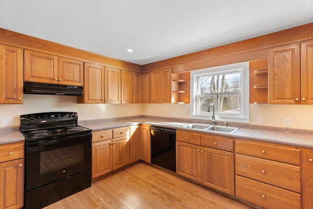 kitchen with light hardwood / wood-style flooring, sink, and black appliances