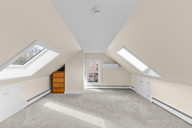 bonus room with baseboard heating, light carpet, and lofted ceiling with skylight