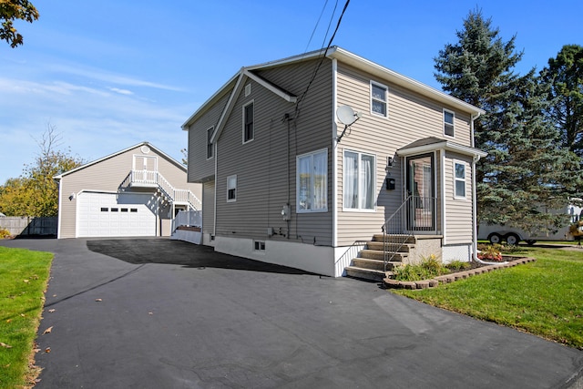 front facade featuring a garage and a front yard